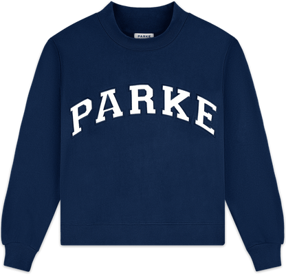 heritage varsity mockneck flat lay -denim + white